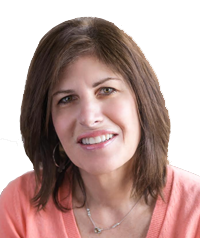 A woman with brown hair, wearing a pink top, smiling at the camera.